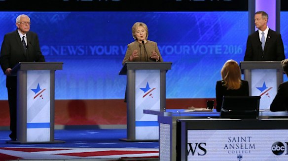 Hillary Clinton speaks between Bernie Sanders and former Maryland governor Martin O'Malley during the debate hosted by ABC News.