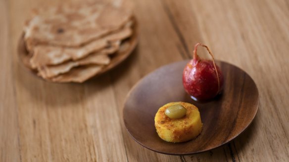 Pickled potato topped with a tiny cured desert lime.