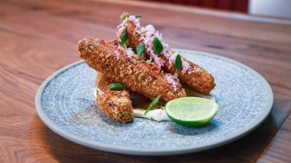 Crumbed fried lamb short ribs with honey, chilli, rosemary and hung buffalo milk yoghurt.