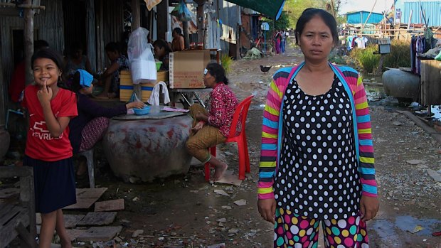 In the flood-prone squatter settlement village on the outskirts of the Cambodian capital, Hour Vanny says she was required under a contract to give birth by cesarean section. 