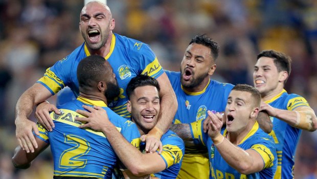 Statement win: Parramatta players celebrate a try.