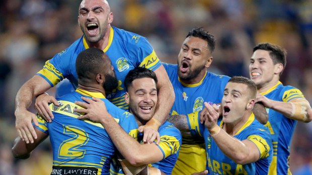 Statement win: Parramatta players celebrate a try over the Brisbane Broncos.
