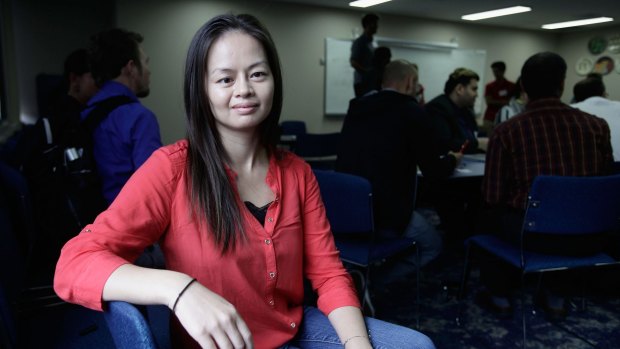 Former refugee now successful startup entrepreneur Shelli Trung is a mentor and judge in a hackathon for refugees.
