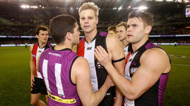 St Kilda midfielder Maverick Weller (right) says captain Nick Riewoldt (centre) is a "real chance to play" against Melbourne this weekend.