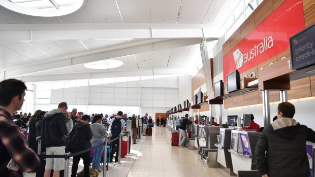 Queues at the Virgin Australia check-in area during its nationwide computer outage at Adelaide Airport on Sunday.