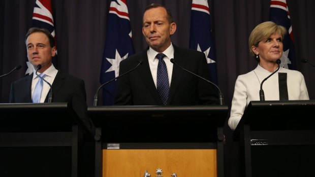 "Climate change is real and important and significant" declared Environment Minister Greg Hunt, pictured (left) with PM Tony Abbott and Foreign Minister Julie Bishop.