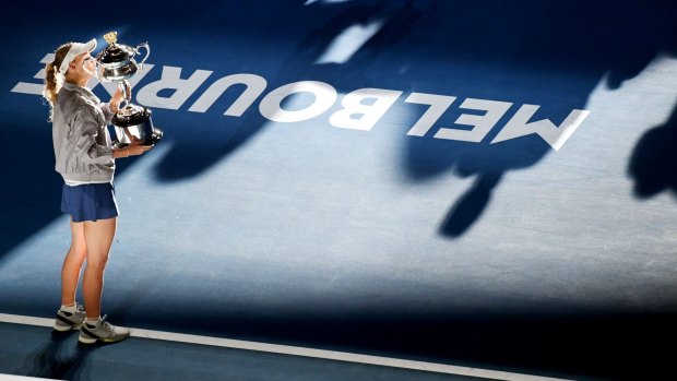 Caroline Wozniacki holds aloft the Australian Open trophy.