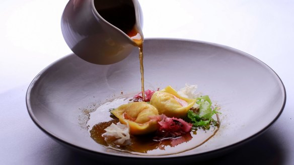 Scallop dumplings with soy mirin broth.