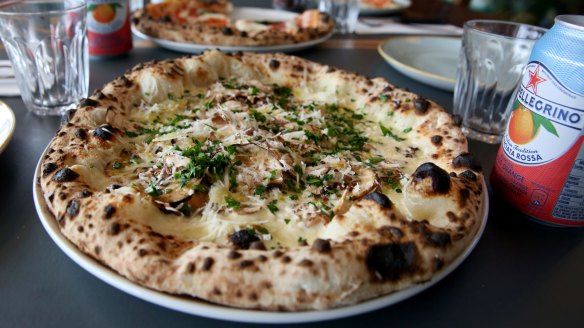 Zio Pino pizza with straccciatella, mushrooms, parsley, parmesan and truffle oil.