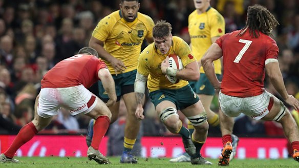 Tough style: Australia's Sean McMahon takes on the Wales defence earlier this month.