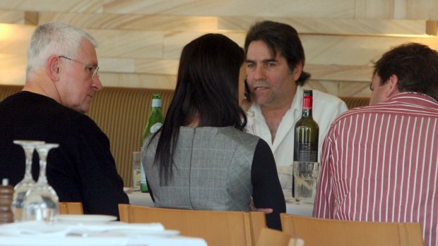 Lucky Gattellari, on the phone, with Ron Medich (left) at a lunch in 2009. 