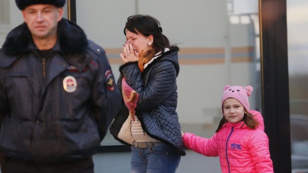 Distraught: A relative arrives at at a hotel near St. Petersburg's Pulkovo airport where relatives have gathered.