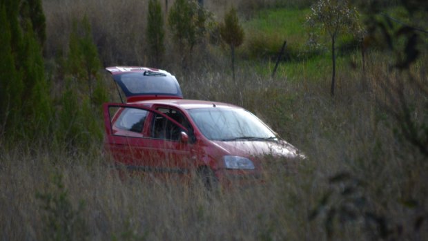 The crashed car, which was being forensically examined. 