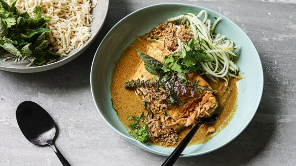 Salmon curry served with shredded papaya on the side (optional).