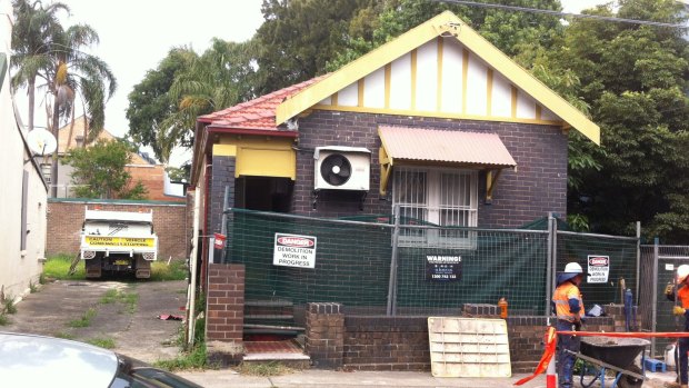 A temporary fence has been erected around Mr Ngo's former home in St Peters.