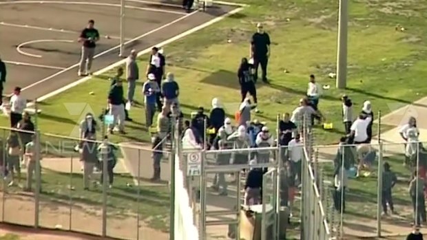 Prisoners stand in the grounds of Metropolitan Remand Centre in Melbourne, Australia, on June 30, 2015.
