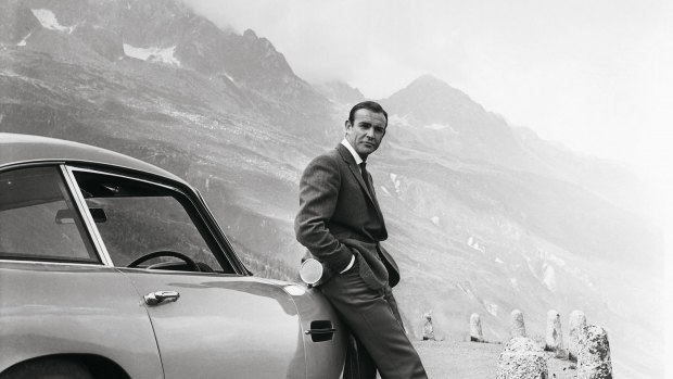 Sean Connery as James Bond, on location in Europe with his Aston Martin.