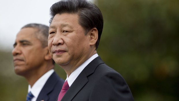 Chinese President Xi Jinping, right, and US President Barack Obama on the South Lawn of the White House in Washington. 