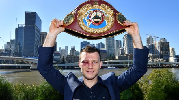 Bruised but not beaten: Jeff Horn proudly displays his WBO welterweight champion’s belt in Brisbane after beating Manny Pacquiao.