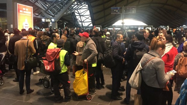 Stranded passengers at Southern Cross Station on Thursday. 