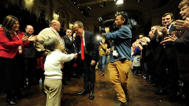 Mr Shorten greets the faithful on arriving at the Sydney Town Hall.