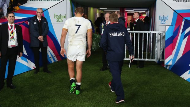 End of the road: Chris Robshaw of England walks off the pitch, his side out of the World Cup.