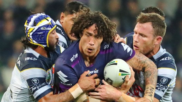 Centre of attention: Melbourne’s Kevin Proctor had his hands full against the Cowboys on Saturday night. 