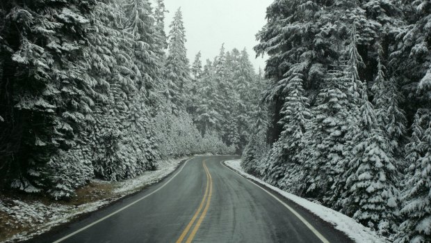 The trip to Crater Lake is a snowy drive.
