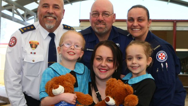 Ambos Michael Magyarry, Graeme Findley and Kim Denic with Kelly McLean and  her brave daughters, 7-year-old Isabelle and Mia, 5.