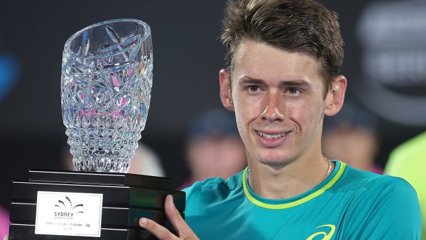 Start of big things: Australia's new tennis star Alex De Minaur holds the runners-up trophy.