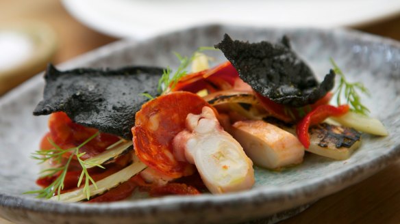 Octopus, chorizo, and squid ink wafer at Tulip restaurant.