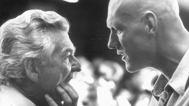 Creative input: Prime minister Bob Hawke getting some advice from Midnight Oil lead singer Peter Garrett on the opening of the Australian Conservation Foundation's new office in 1989.