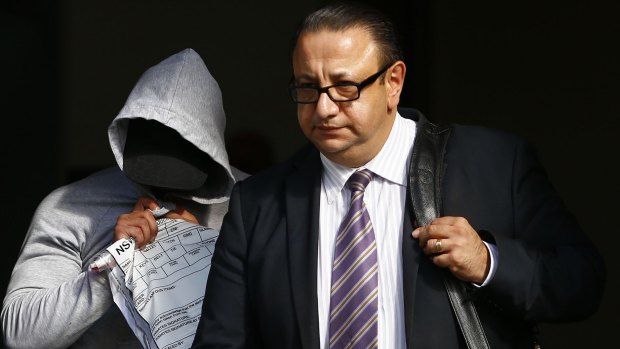 Mohammed Alameddine, left, leaves Bankstown Local Court with his lawyer Elias Tabchouri in April.