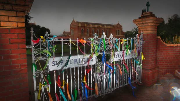 Ribbons tied to the front gate of St Patrick's College in support of abuse victims.