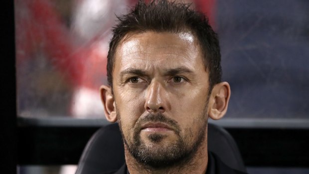 On the brink: Tony Popovic looks on, knowing the Wanderers would need a miracle to qualify. 