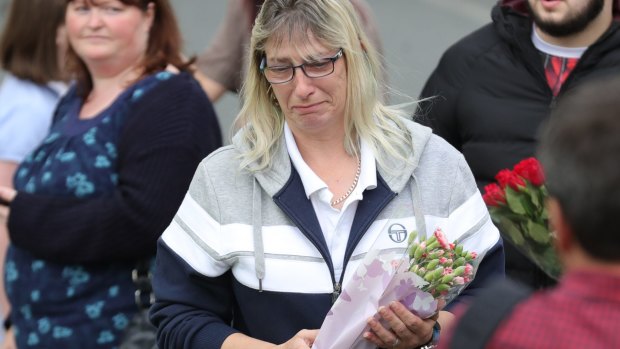 People arrive with floral tributes after the murder of Jo Cox.