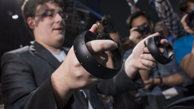 The new Oculus Touch controller is demonstrated during the "Step Into The Rift" event .
