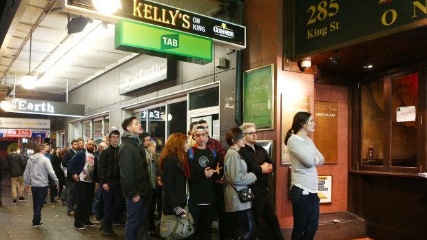 People line up to get into a pub in Newtown on June 13.