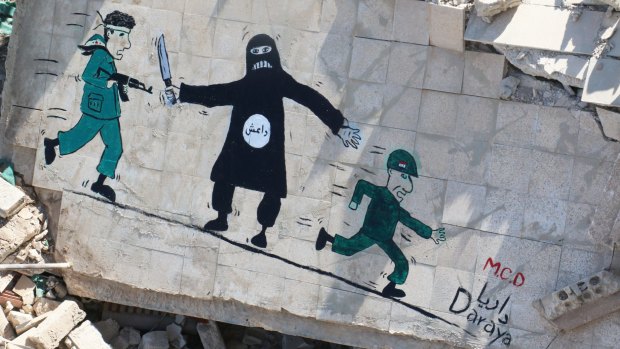 A mural in the besieged Syrian city of Daraya accuses Syrian government troops (right) of fleeing in the face of black-clad militants of Islamic State, leaving rebels (left) to fight them.  