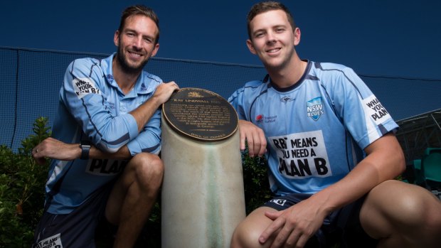 Honour: Trent Copeland and Josh Hazlewood with the Ray Lindwall monument. 