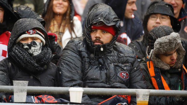 Fans at Soldier Field are bundled up as they watch the Chicago Bears and the San Francisco 49ers.