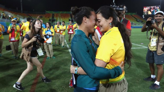Love match: Rugby player Isadora Cerullo (left) of Brazil and volunteer Marjorie Enya embrace after the marriage proposal.