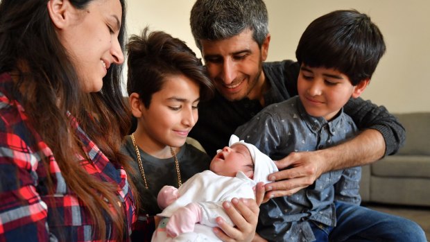 'She's going to be an Aussie': Week-old Melbourne-born baby Onita and her family from Iraq, father Faris Sora, mother Diana Shaheen and brothers Martin, 10, and Noorseen, 6, are grateful for their new life in Australia. 