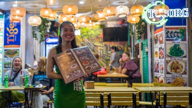 Waitress at Bia Hoi corner, Hanoi, where venues are high on quality and low on pretence.
