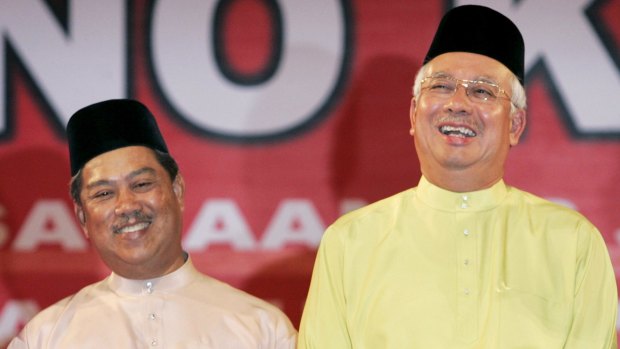 Malaysian Prime Minister Najib Razak (right) axed his deputy Muhyiddin Yassin share a lighter moment in 2009.