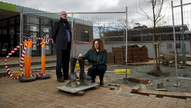 Cultural Canberra director Adam Stankevicius and artist Giovanna Ianniello with the  remainder of the stolen statue 'Stepping Out' at the Hughes shops.