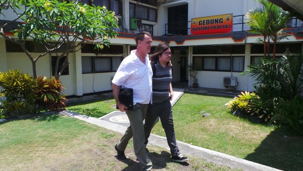 John Elllis arrives at the police station in Bali.