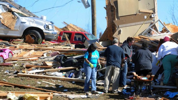 Residents of Petal, Mississippi, continue with the clean-up from Saturday's twister that damaged much of the city.