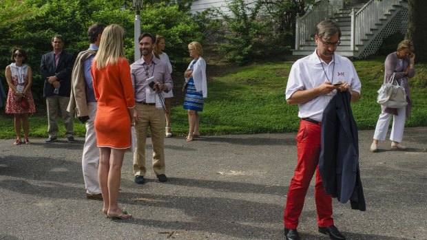 Donors wait for a trolley to take them to the Bush family compound in Kennebunkport, Maine, in July of this year. 