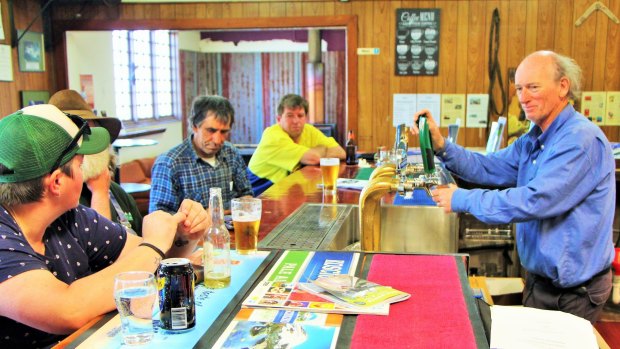Kelvin Fahey, new owner of the Federal Hotel, serving thirsty locals.